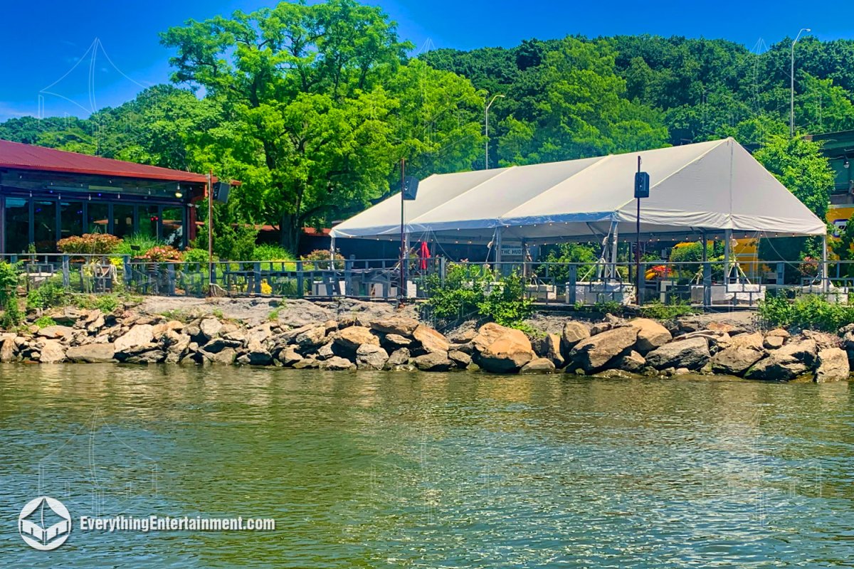 Everything Entertainment installed a custom 30x45 frame tent directly along the rocky shoreline of the Hudson River for an exclusive post-event gathering. Set up at The Hudson in Manhattan, this waterfront installation provided open-air party space with s