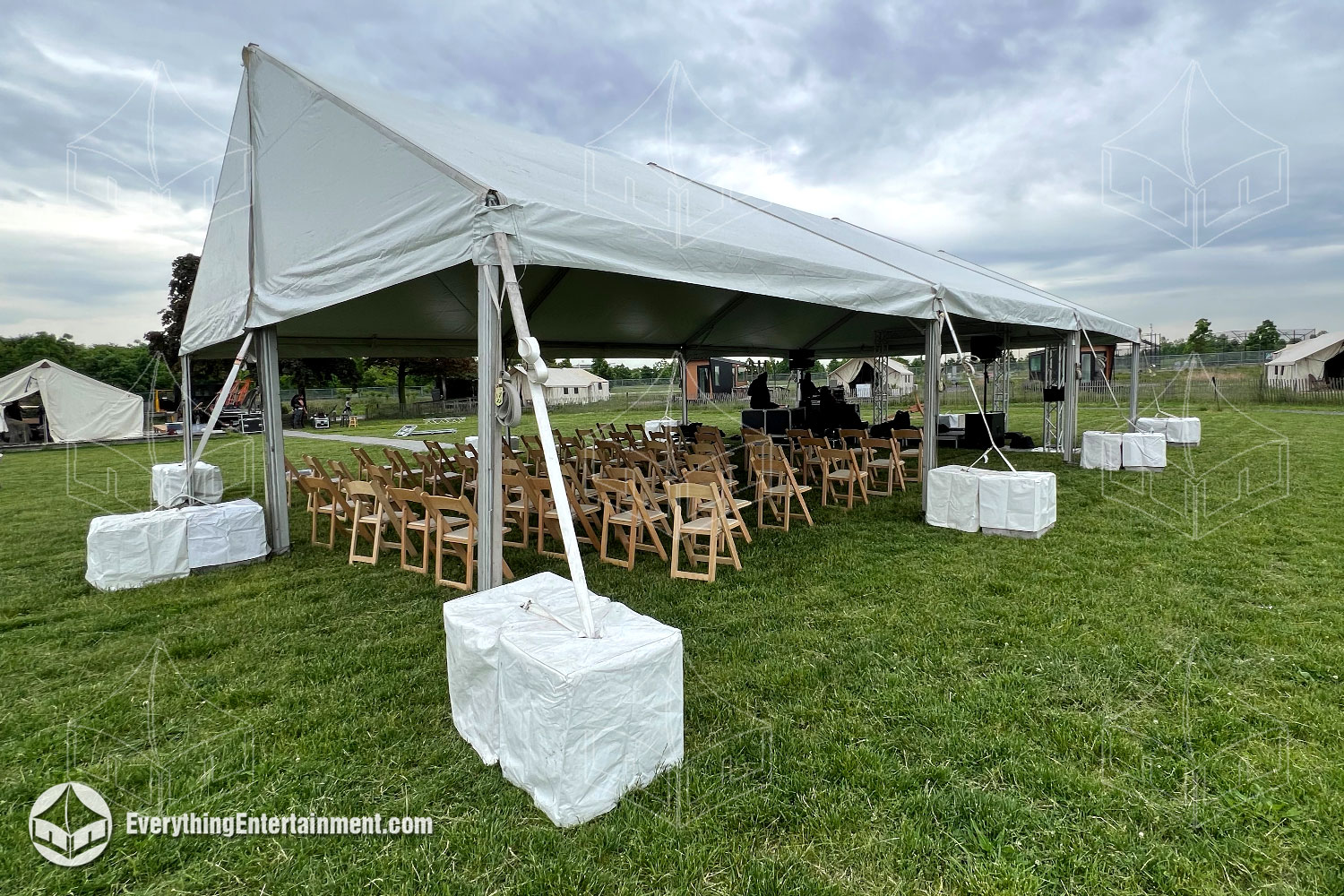 30x45 foot frame tent setup on grass on Governors Island