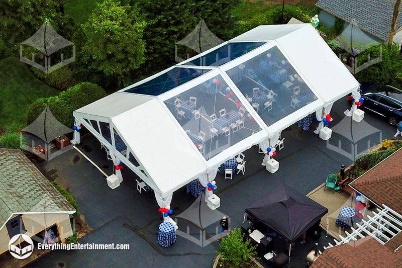 30x50 foot frame tent with clear and white tops setup on asphalt