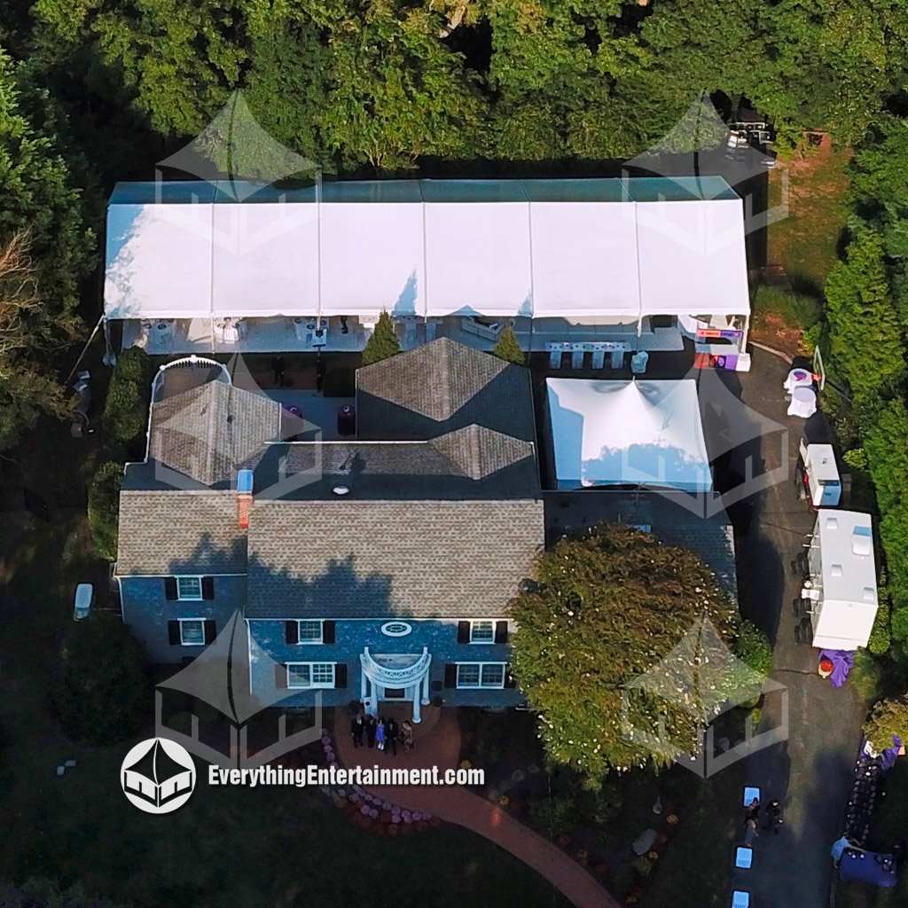 Aerial view of a 30x90 frame tent and adjacent 15x20 tent set up in a private backyard for a Sweet Sixteen celebration in New Jersey.