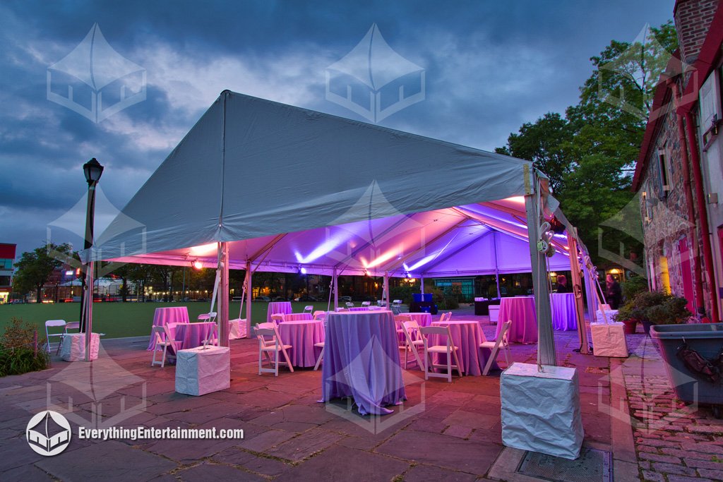A 40x60 maxi frame gable ended tent with purple and pink LED lighting set up on the patio at The Old Stone House in Brooklyn NY by Everything Entertainment.