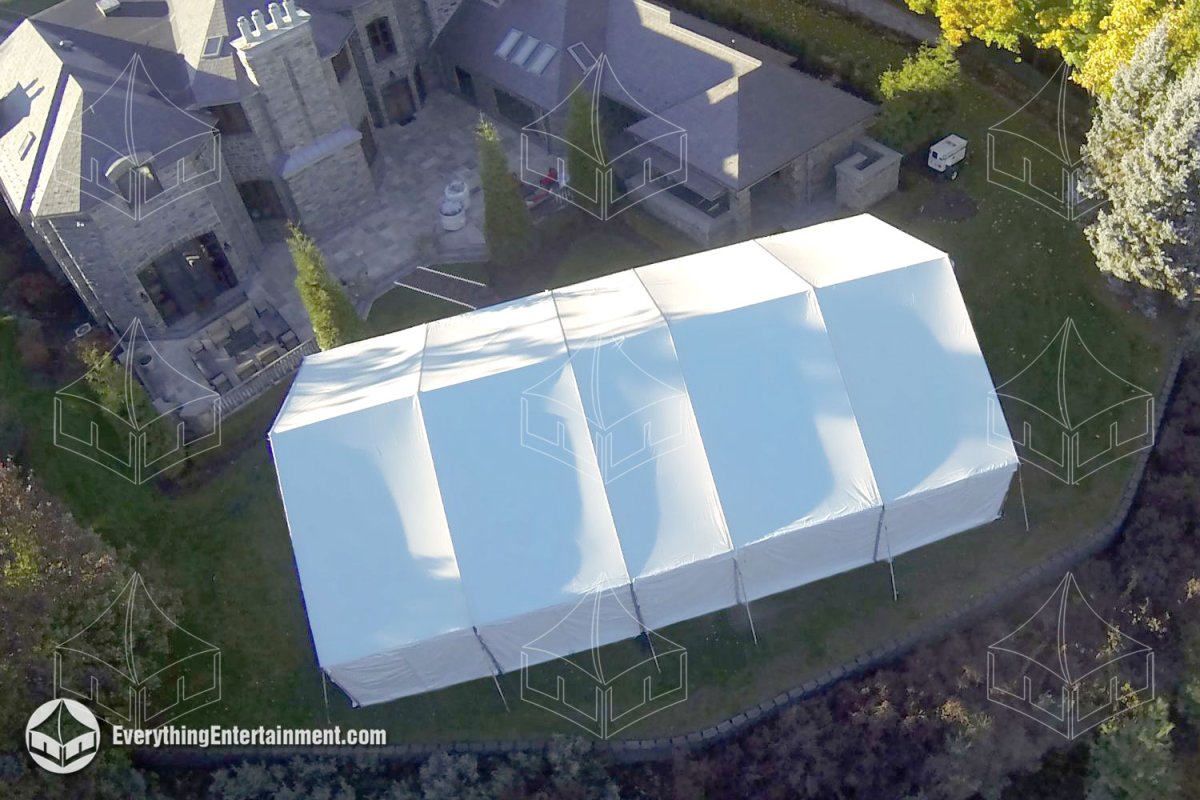 High-angle aerial view of a 40x70 white maxi frame tent installed alongside a luxury estate in Upper Saddle River NJ by Everything Entertainment.