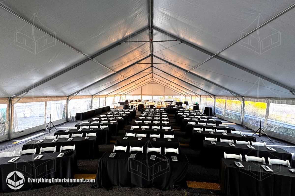 Interior view of a 50x120 white maxi-frame tent with Seminar Seating in Secaucus NJ by Everything Entertainment.