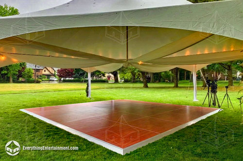 A 16x16 Dance Floor underneath a 35x40 High Peak Hext Tent