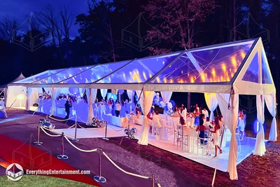 A clear top tent with colorful LED lights with a carpeted floor in Freehold, NJ