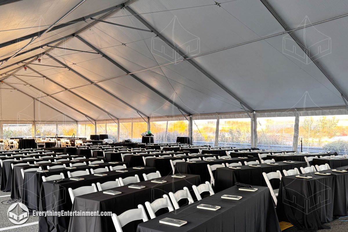 Interior view of a 50x120 white maxi-frame tent with Seminar Seating in Secaucus NJ by Everything Entertainment.