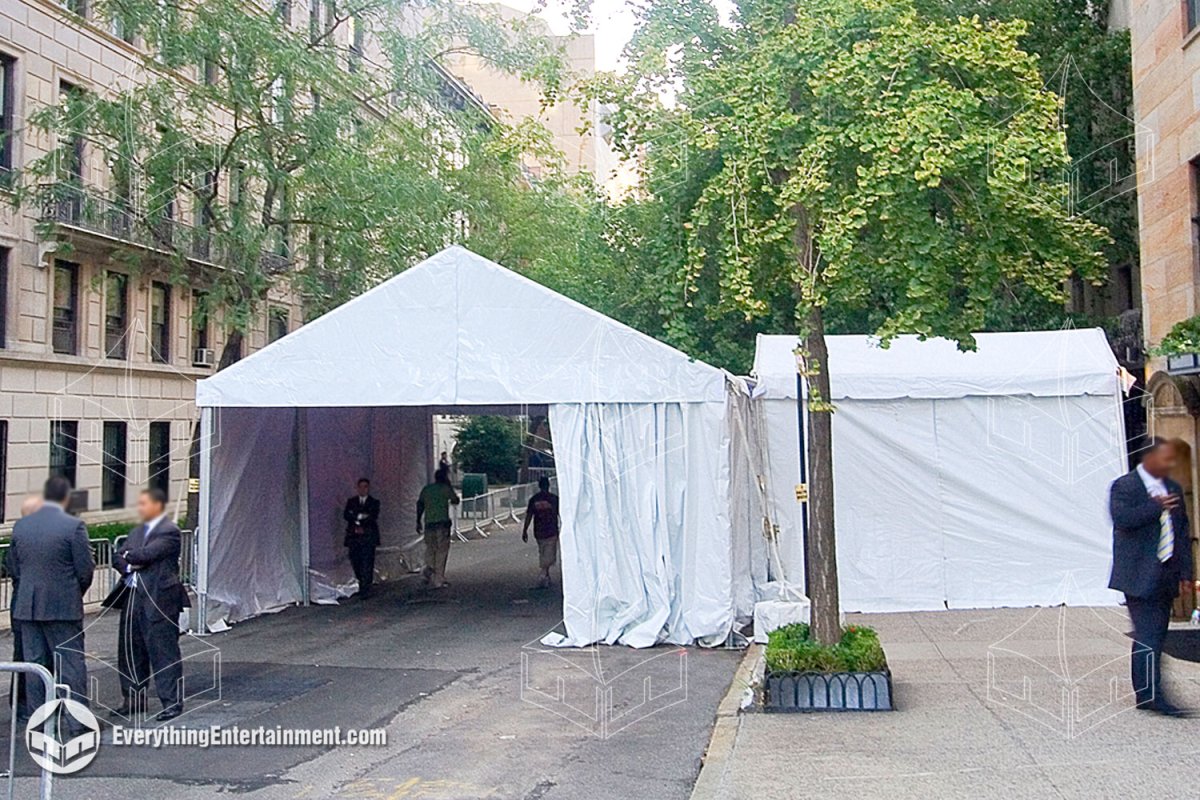 A 20x30 vehicle drive-through screening tent installed along a city street curb in NYC by Everything Entertainment.