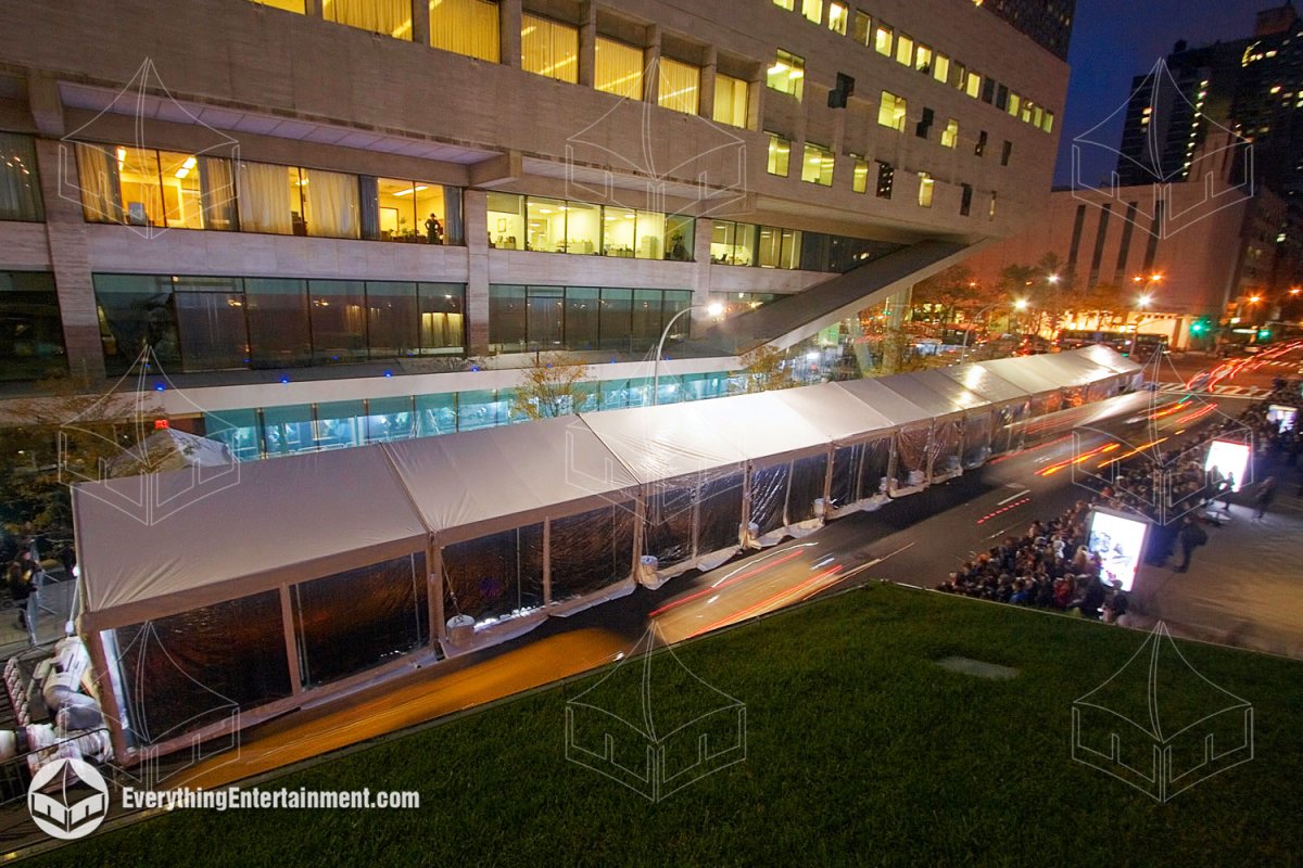Elevated night view of a 20x180 red carpet tent with HVAC and subfloor outside Alice Tully Hall at Lincoln Center by Everything Entertainment.