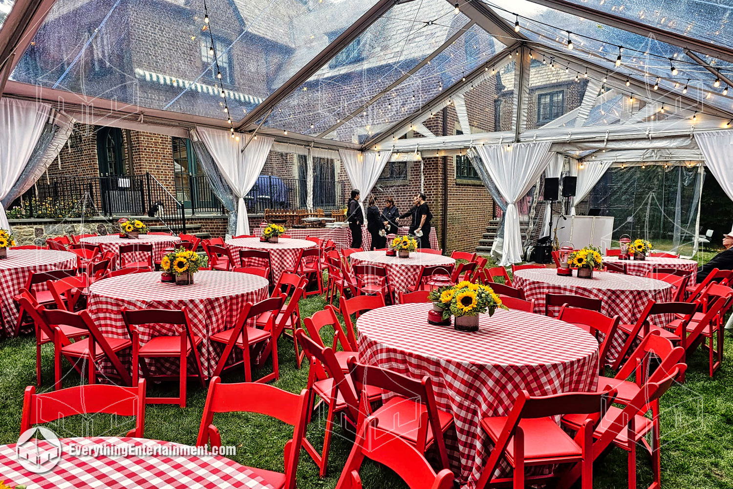 Stunning 30x50 clear-top tent with vibrant red and white rentals, adding flair to your special celebration.