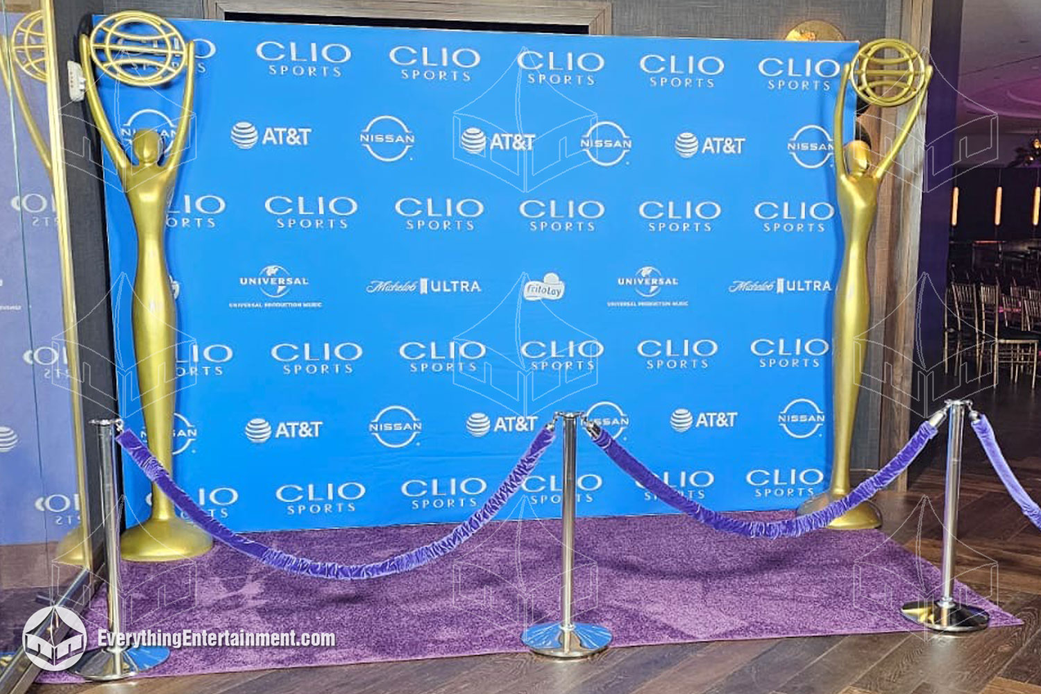 Custom 8x12 step-and-repeat wall and purple carpet and ropes, perfect for branding and photo opportunities at your event.