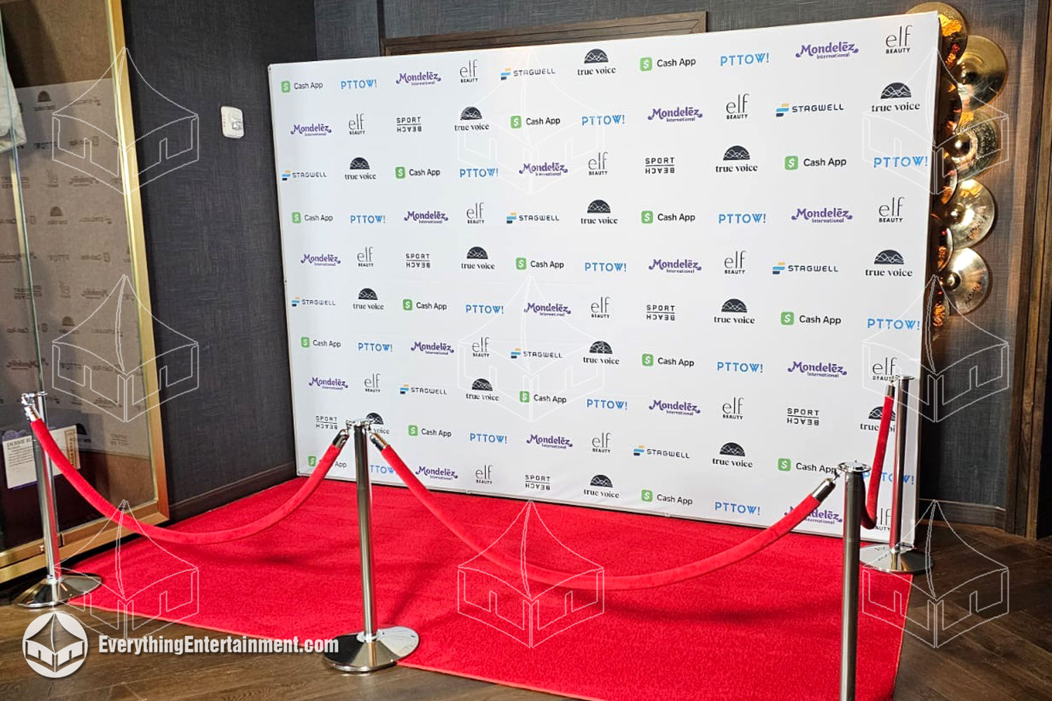 Classic 8x12 step-and-repeat wall with a red carpet, creating a perfect photo-op for prestigious events and premieres.