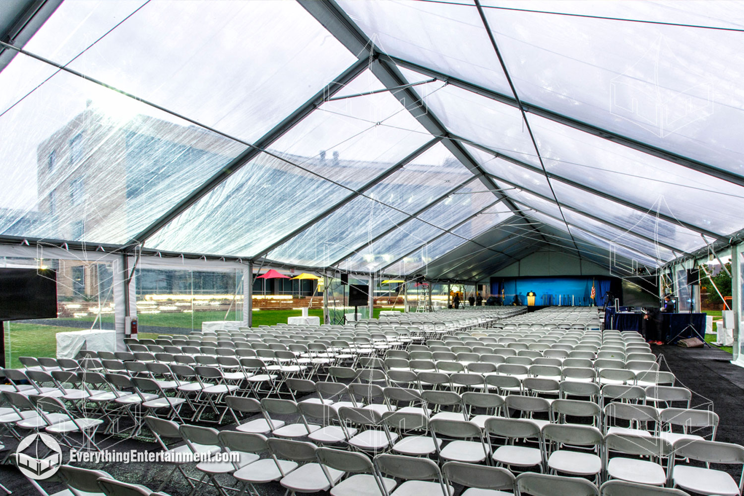 Versatile clear top tent, designed to create an open yet sheltered environment for corporate events, providing both style and protection.