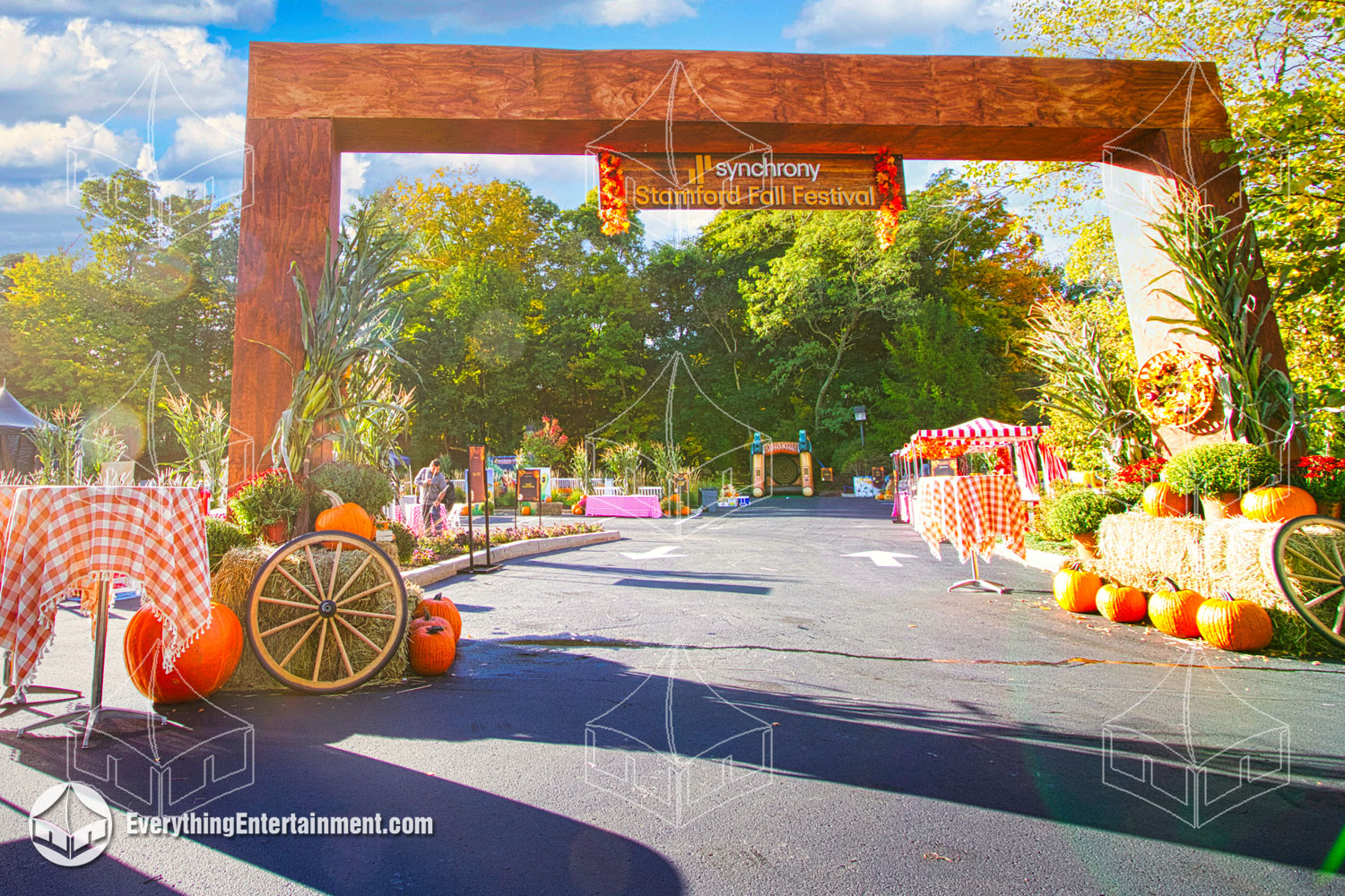 Fall festival entrance by Everything Entertainment with branded archway, festive decor, and vibrant design to welcome guests in style.