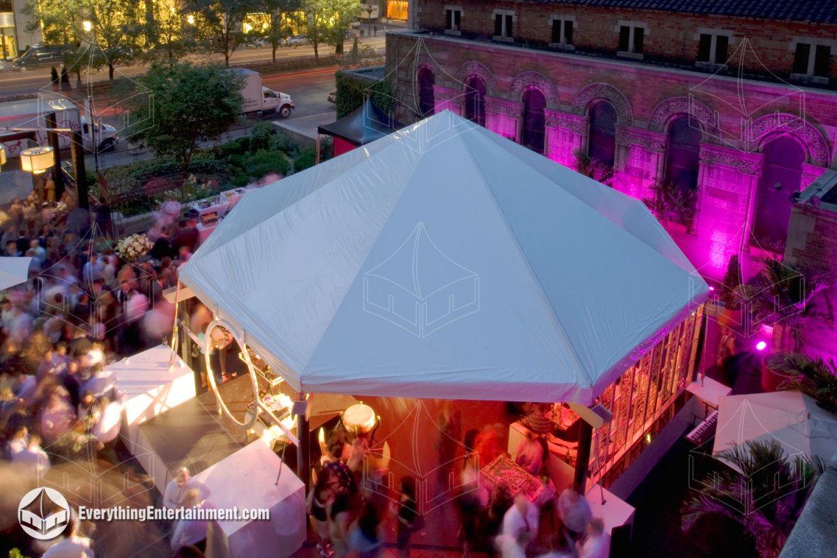 High-angle aerial view of a 40x40 specialty maxi-frame octagon tent with LED lighting and a custom octagonal subfloor installed on the terrace at St. Bartholomew's Church in NYC by Everything Entertainment.