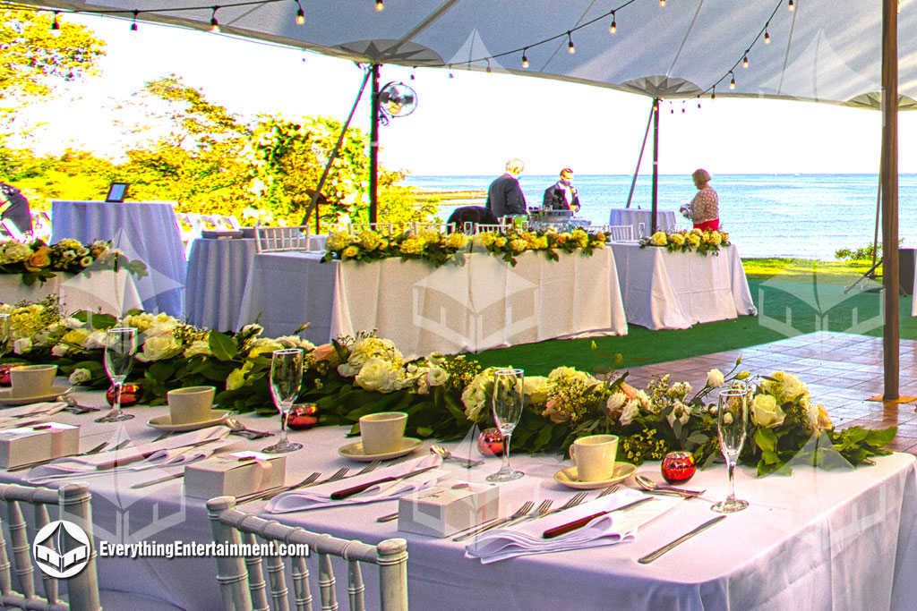 tables and chairs under tent