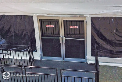 Tent doors on a large frame tent surrounded by clear tent walls with an ADA ramp leading into the tent in Rockaway Beach, NY