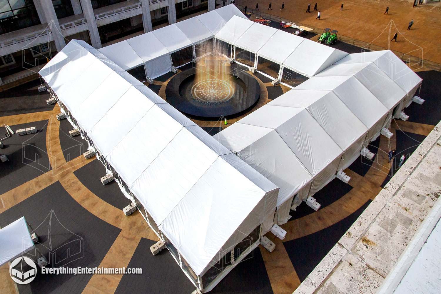 Four large tents set up at Lincoln Center surrounding the Revson Fountain