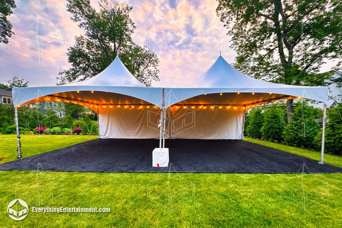 Two 20x20 high-peak frame tents with bistro string lights and a black carpeted subfloor set up on a New Jersey lawn by Everything Entertainment.