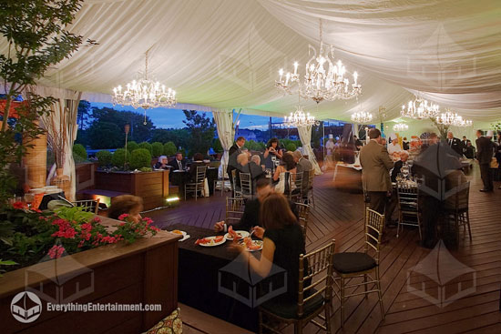 Wedding tent with fabric liner and crystal chandeliers.