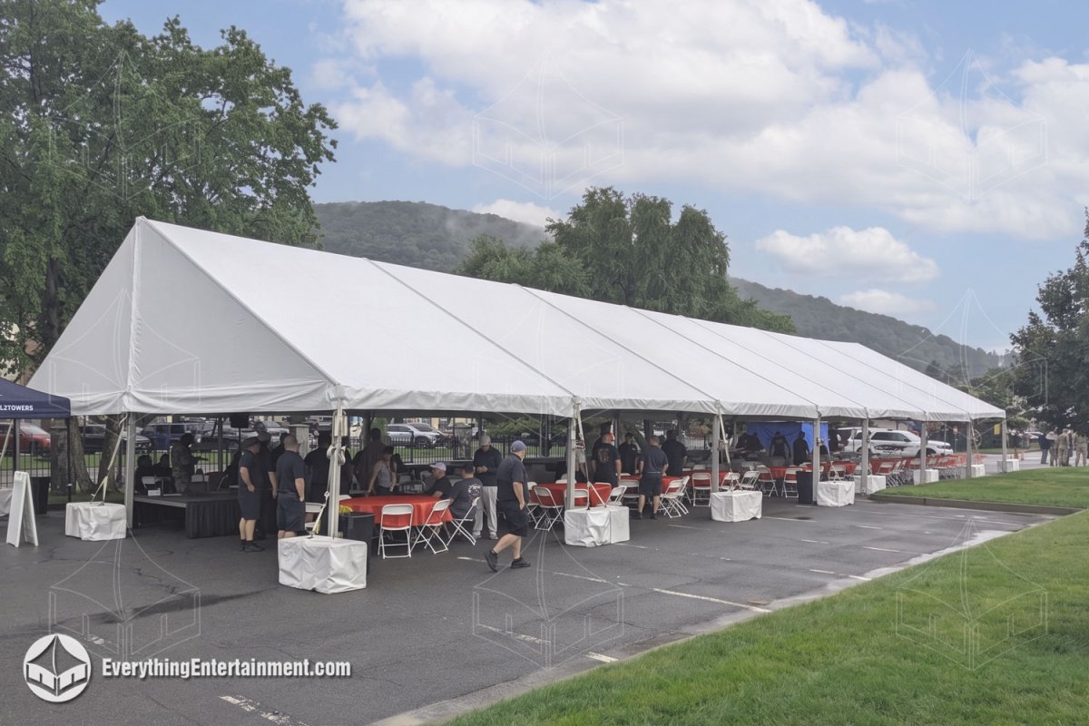Exterior of a 40x120 food service tent with concrete ballasts and seating at West Point Military Academy by Everything Entertainment